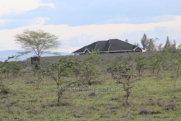 Panoramic view of Mwalimu Farm Community in Ruiru East, showcasing lush green landscapes, well-constructed access roads, and plots available for ownership. Explore the beauty and sustainability of Mwalimu Farm with affordable 1/8 acre plots from Sunsera Realtors.